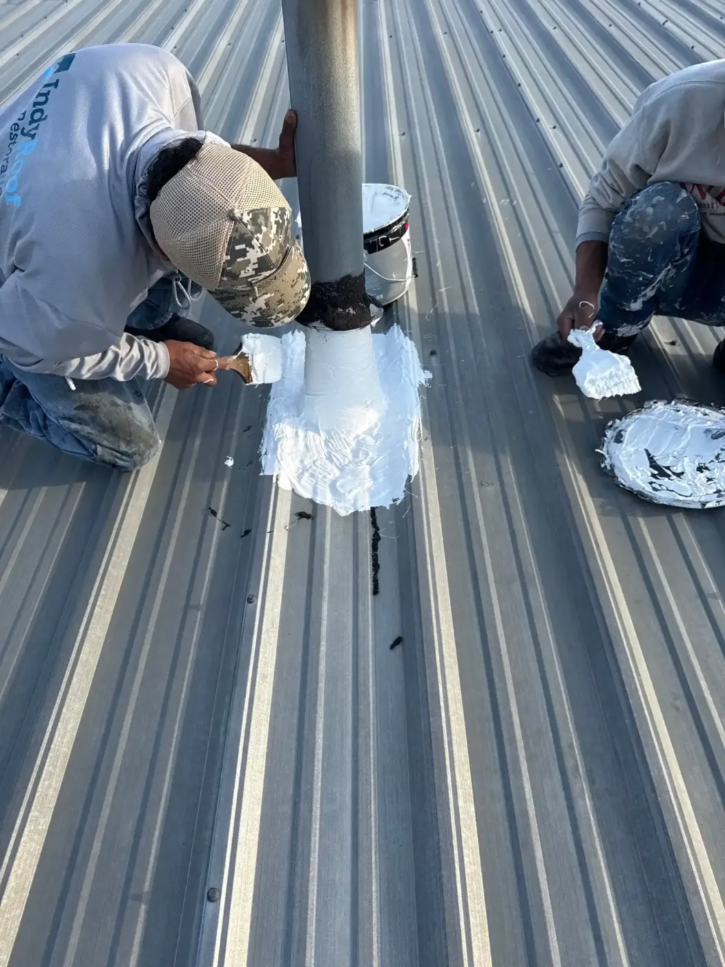 Tarping and dry-in on a Smokey Row commercial roof